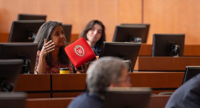 Shobhina Chheda, MD, MPH, professor, General Internal Medicine, poses a question to Dr. Holguin during Grand Rounds.