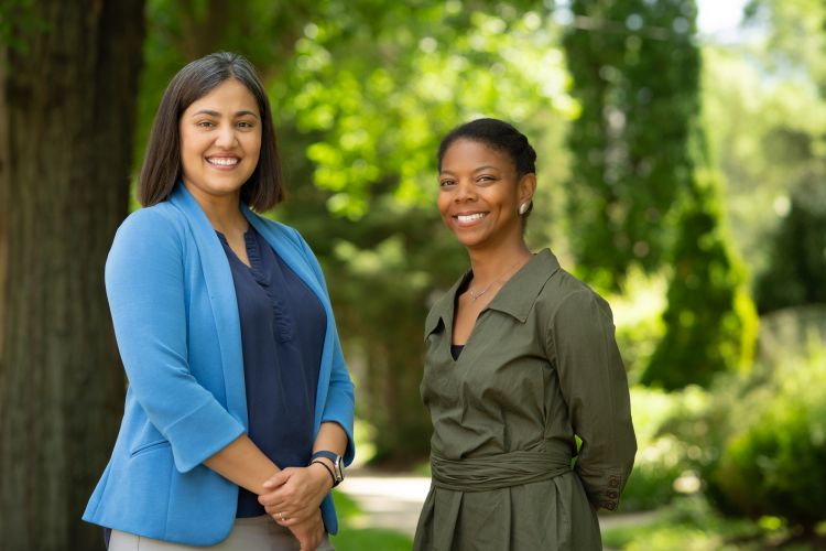 Dr. Pophali, on left, with Cibele Barbosa Carroll, MD, PhD, MPH, a scientist in the cancer survivorship research program.