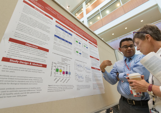 Dr. Freddy Caldera discusses his poster at Research Day