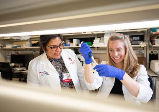 Dr. Ann Marie Singh mentors a fellow in the lab