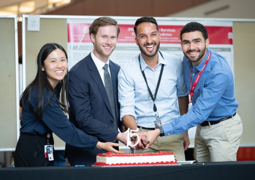 Four internal medicine residents shared in the ceremonial cutting of a cake in celebration of the 15th anniversary of Research Day. L-R: Jeanette Liou, MD, chief resident; Clayton Skogman, MD, PG-3; Bikrum Chahal, MD, PG-3; and Ahmed El Shaer, MBBS, chief resident.