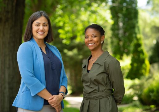 Dr. Pophali, on left, with Cibele Barbosa Carroll, MD, PhD, MPH, a scientist in the cancer survivorship research program.