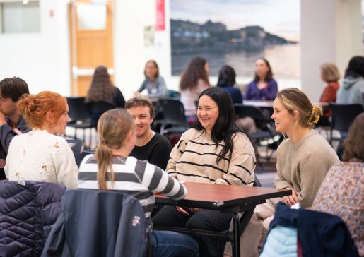A group of smiling students at a table